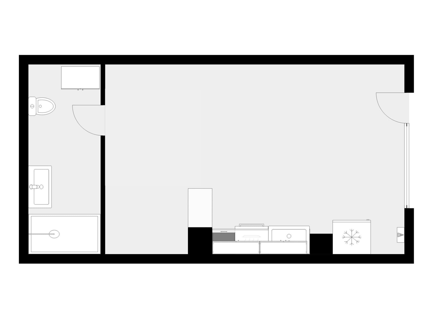 Planta del loft: baño con lavadero a la izquierda, estancia única y cocina en línea al fondo